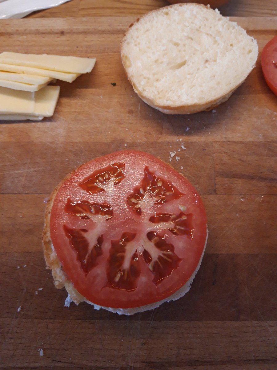 Step 7: layers. I warmed the buns but didn't toast them; feel free to toast. I went for relish (on both halves of bun) and a giant tomato slice, feel free to add pickles, lettuce, other burger gubbins.