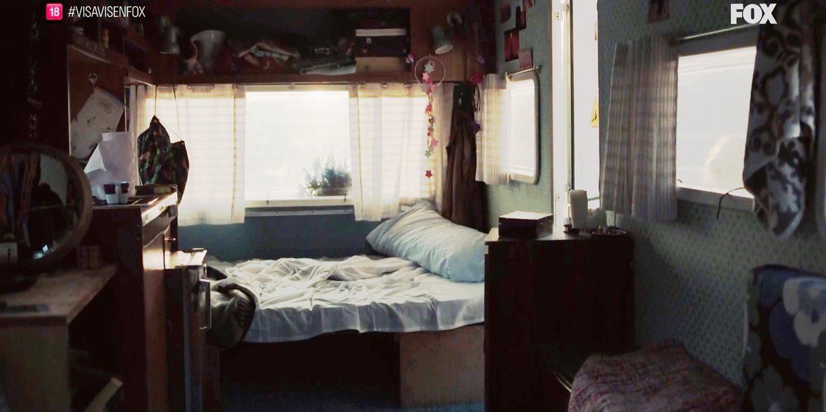 The inside (the front): we can see the same window, the same counter/stove and the bed can turn into a table