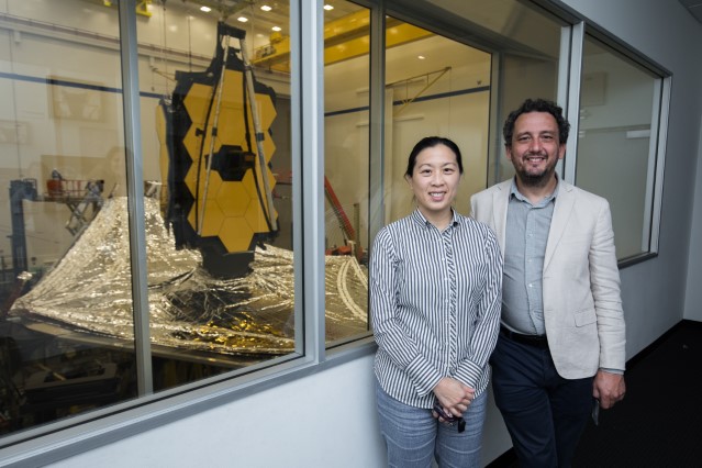 Amy Lo in front of the James Webb Space Telescope.