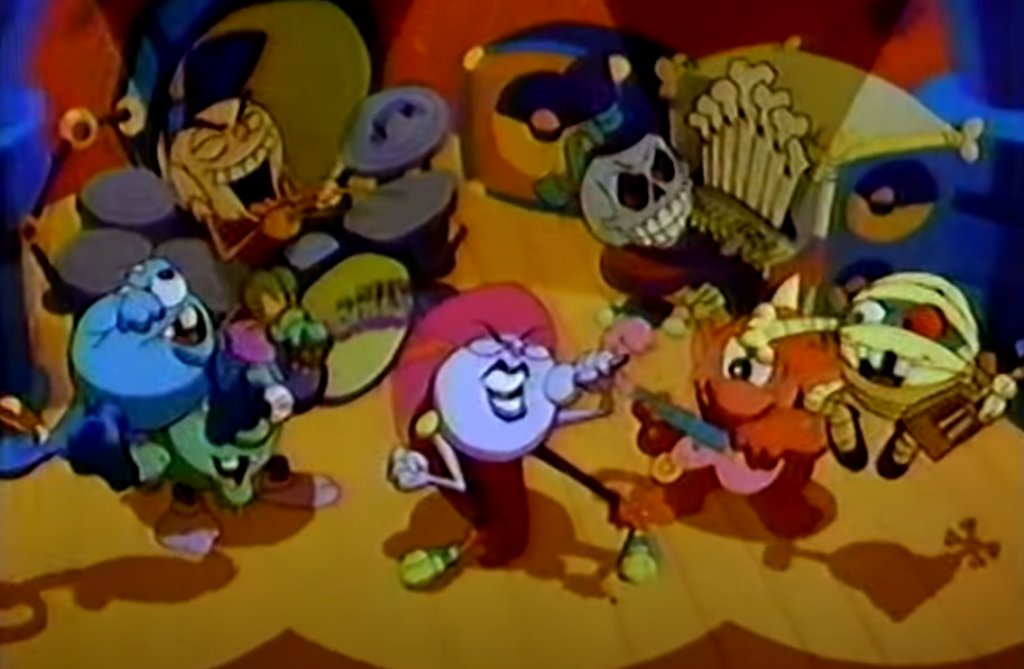 Here's the whole band. Notice there's seven of them including the singer. Each of the other characters in this shot is supposed to be the animated version of those six balls in the first picture.