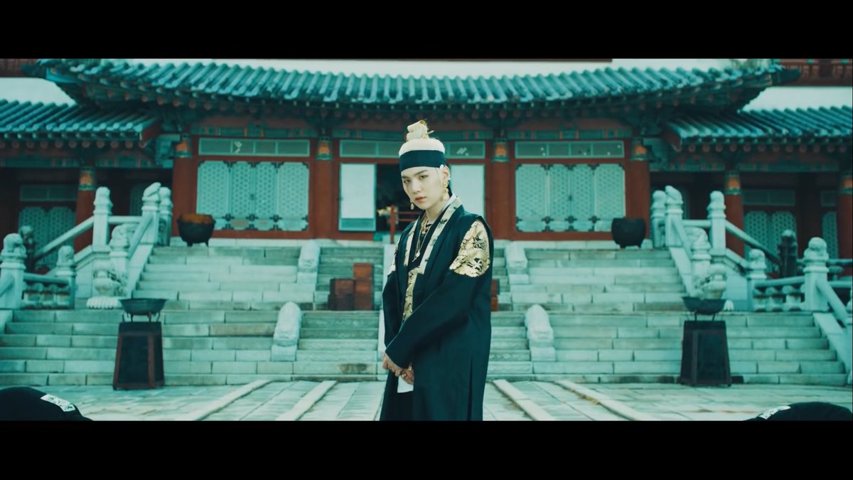 Okay, but he looks so pretty? And the temple behind him is a massive vibe