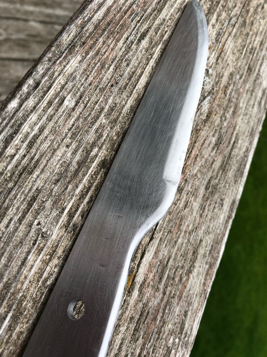 Sanded the knife by hand and drilled some holes for the handle attachment. I think the next step is heat treatment. Guess I’ll be building a hot charcoal fire this weekend and seeing what happens!