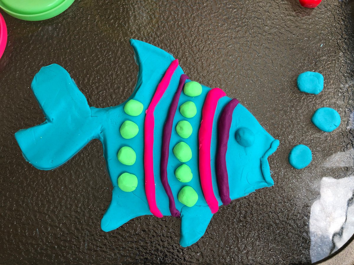 blue_council's tweet photo. Lexi Peets representing the Student Council with a playdough fish and that coveted 5 headed Lego man. @Plainville2020 #VirtualFieldDay https://t.co/oMY3DEAFBn