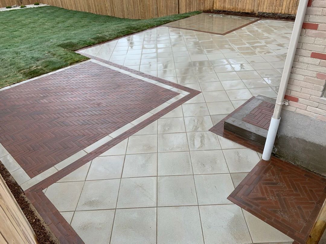 This color combo and design 😍. <a href="/techobloc/">Techo-Bloc</a> Para slab has beautiful smooth texture and contemporary look while the merlot colored Westmount in a herringbone pattern is a perfect compliment.  Visit techo-bloc.com to see more product options for your next patio design!