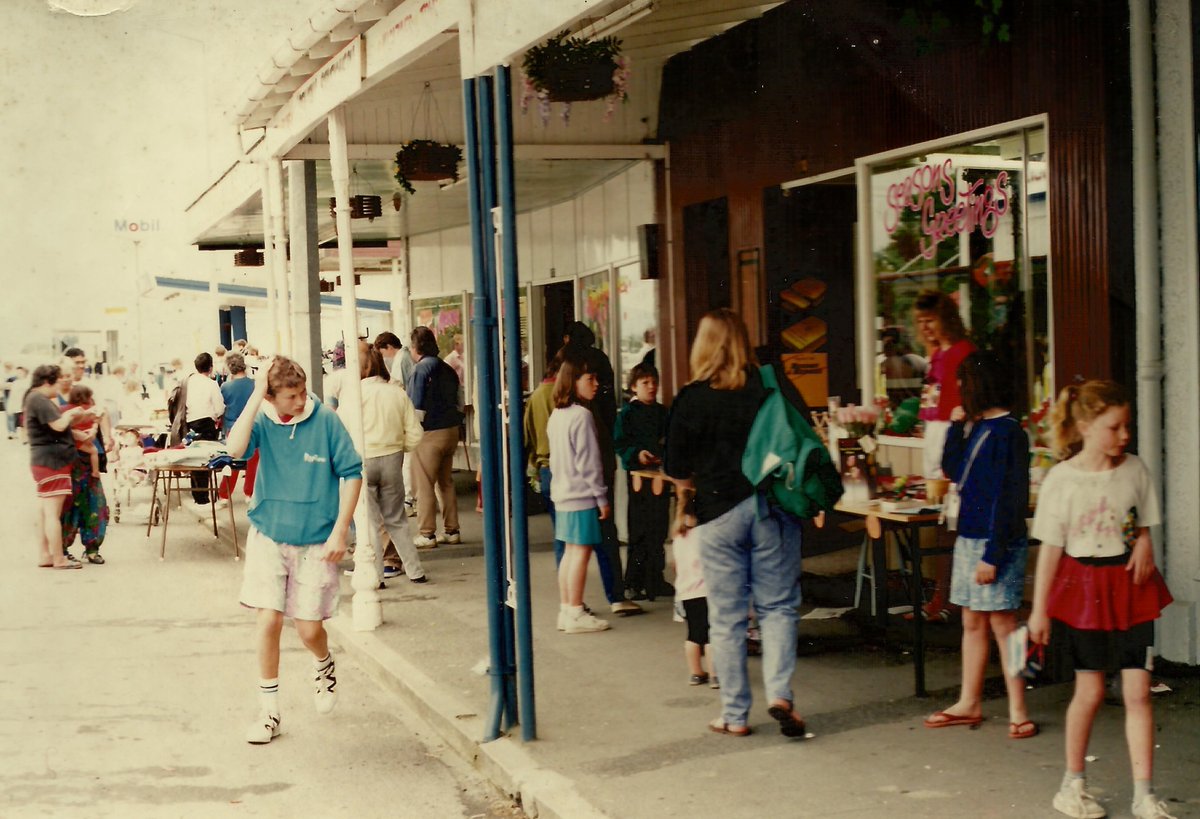 Main St documentary cont: pre & post Covid: 1. Originally Ketteg's, Mick Gonley bought/rebuilt (Winnie Davin's father) here in 1919, CC 0; 2. Cont. as barber/stationers w/diff owners, here Carletons Chemist 1991, CC BY; 3. A Cut Above 2008, CC BY; 4. Now a residence/retail, CC BY