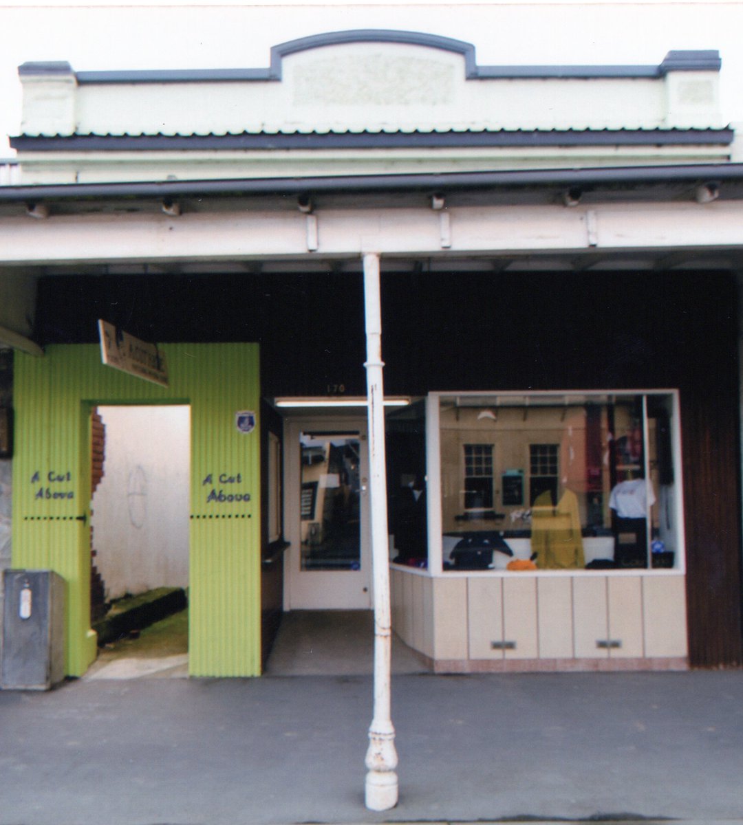 Main St documentary cont: pre & post Covid: 1. Originally Ketteg's, Mick Gonley bought/rebuilt (Winnie Davin's father) here in 1919, CC 0; 2. Cont. as barber/stationers w/diff owners, here Carletons Chemist 1991, CC BY; 3. A Cut Above 2008, CC BY; 4. Now a residence/retail, CC BY