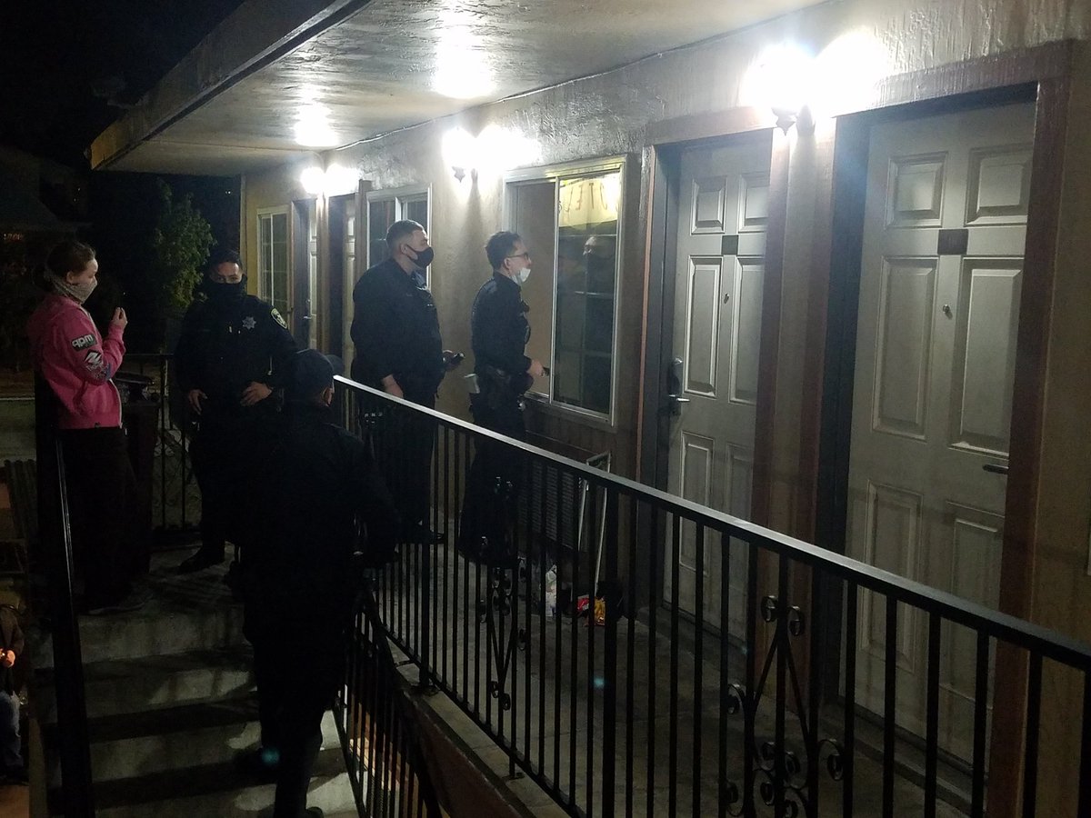 4 squad cars here now. Cops knocked on room door first, but Stefani can't open door, then speaking to her through window.