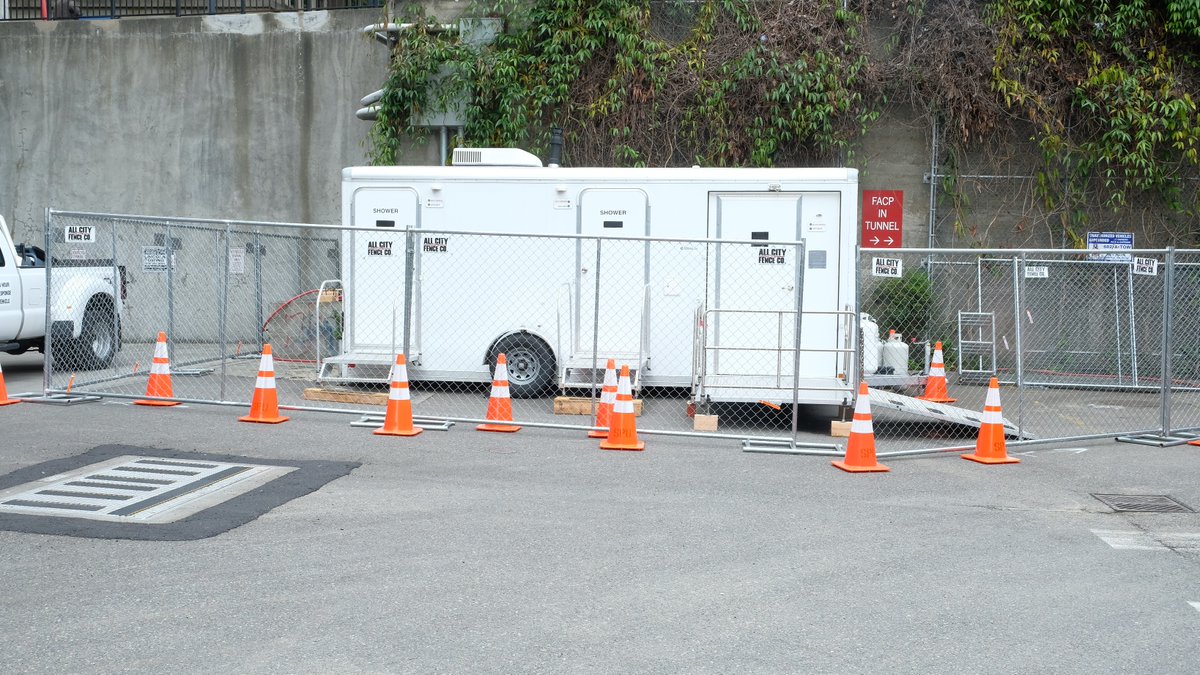 Found the city of Seattle's shower trailer! Tucked away behind King Street Station, in a spot not visible from any street, and still fenced off yesterday despite an announced Friday opening date.