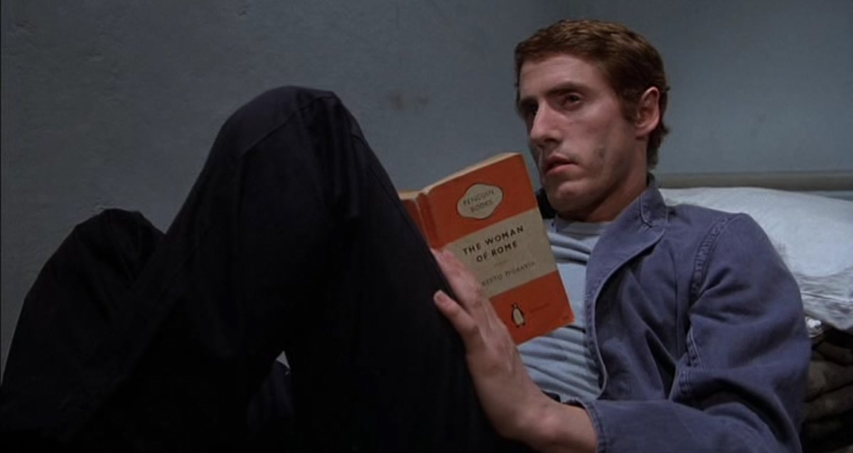 AdamScovell's tweet photo. McVicar is a gloriously grim prison escape film that manages its cast brilliantly and has an enjoyably bizarre Jeff Wayne score. Daltrey is superb (on screen and belting out the film's vocal tunes) and loved the image of him reading an Alberto Moravia Penguin novel in his cell. https://t.co/KZRSmS8huT