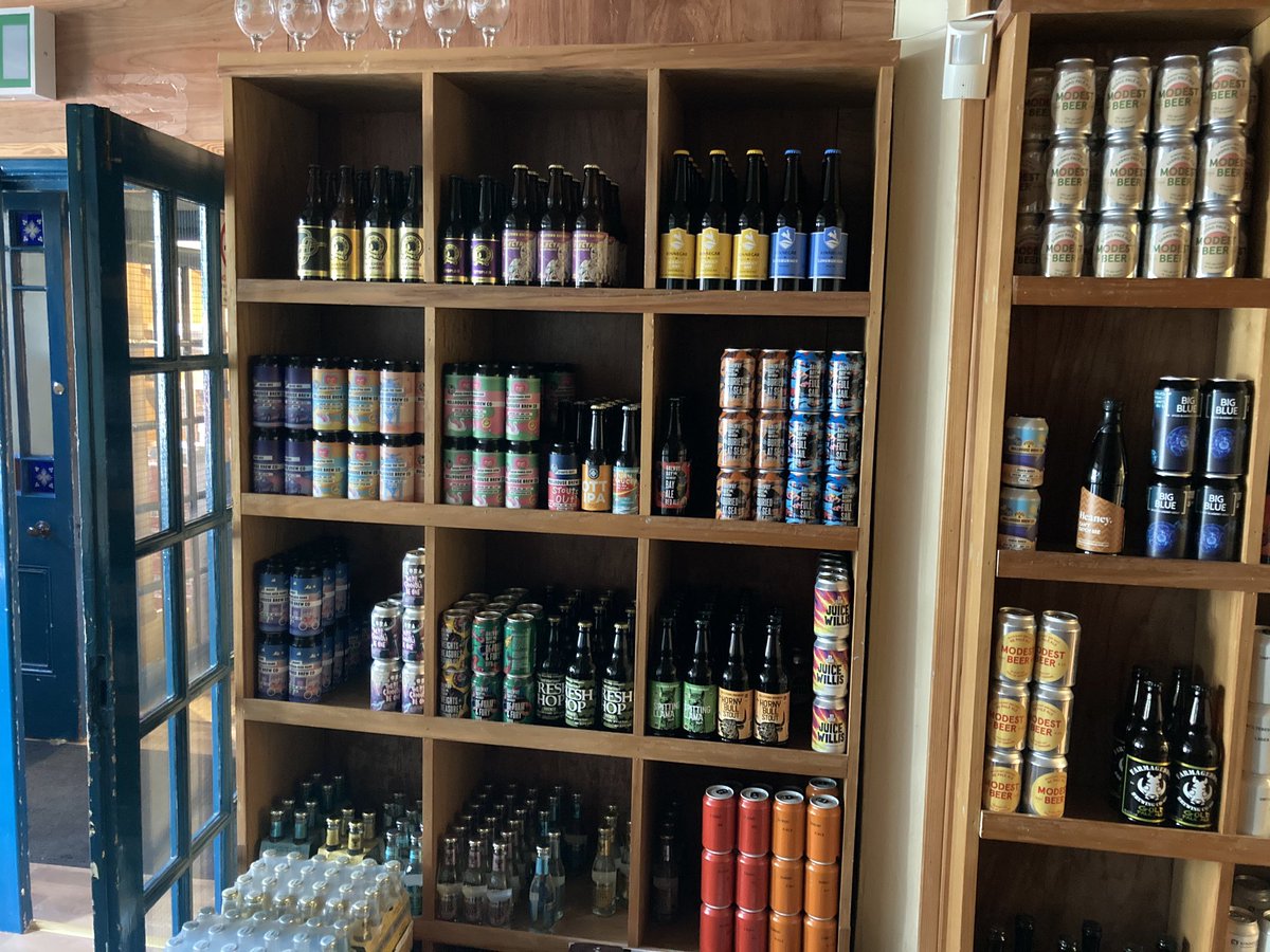 neillwine's tweet photo. Beer wall @neillwine has taken a bit of a beating but we are doing our best to keep it stocked. Have a browse of the wall just like you were in the shop. Free delivery on orders over £40.00 in a 20 mile radius of our shops #callacave thanks to our suppliers for keeping us stocked https://t.co/bDxEEuinAp