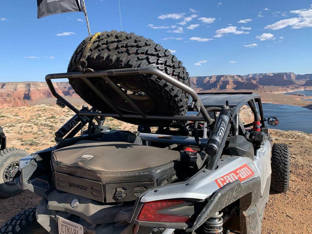 UTVGuide's tweet photo. Put 600 miles on the new @assaultutv tire carrier and we are super happy with how it performed. Love having access under the tire for more storage. And the tire held firmly in place while driving over rough terrain with no rattles. #AssaultEquipped #Mav… https://t.co/HDqKO1cTp2 https://t.co/rBrtPe9PPp