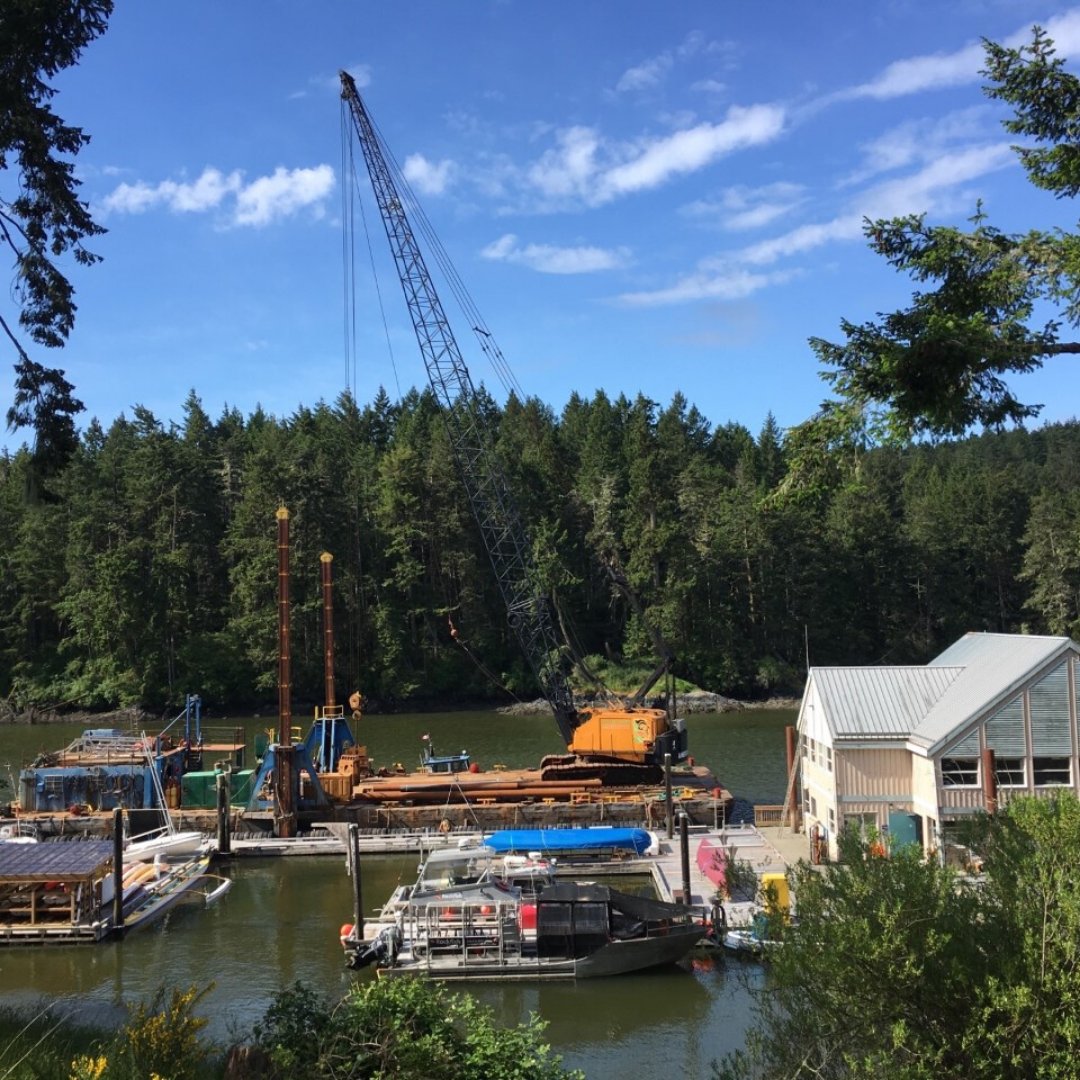 PCUWC's tweet photo. This past week the Salish Sea Industries crew completed the replacement of the #pilings around our #floatingbuilding. They safely completed the assignment with precision & attention to detail under some very challenging circumstances. #Safetyfirst #maintenance #repairs #gratitude https://t.co/j8L2rVB5UO