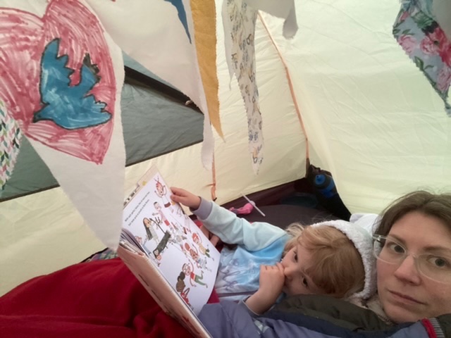 Tucked up and reading our bedtime story, surrounded by our peace bunting. Enjoying the #BigCampIn and #DreamBigAtHome with @woodcraftfolk