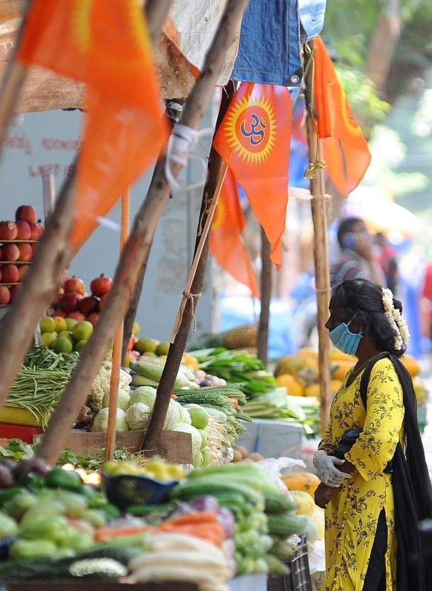 IndPointMedia's tweet photo. Saffron flags introduce religious divide at Vijayanagar market

Entering the Vijayanagar market lane, it is clear which shopkeeper or street vendor is from Hindu community due to a large number of saffron flags tethered to shops and makeshift tents of street vendors. https://t.co/EaANFnZnZl