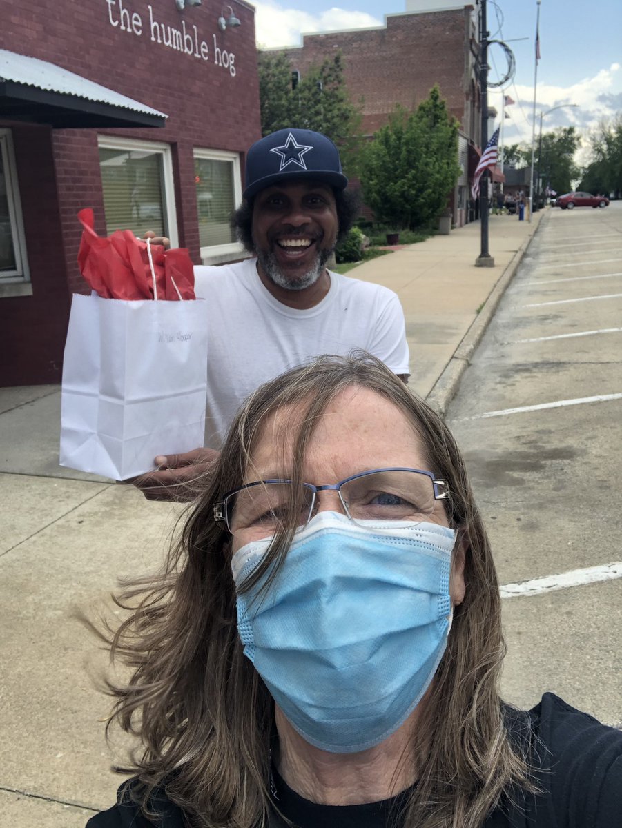William Hooper getting his goody bag from LaFamilia. He was pleasantly surprised