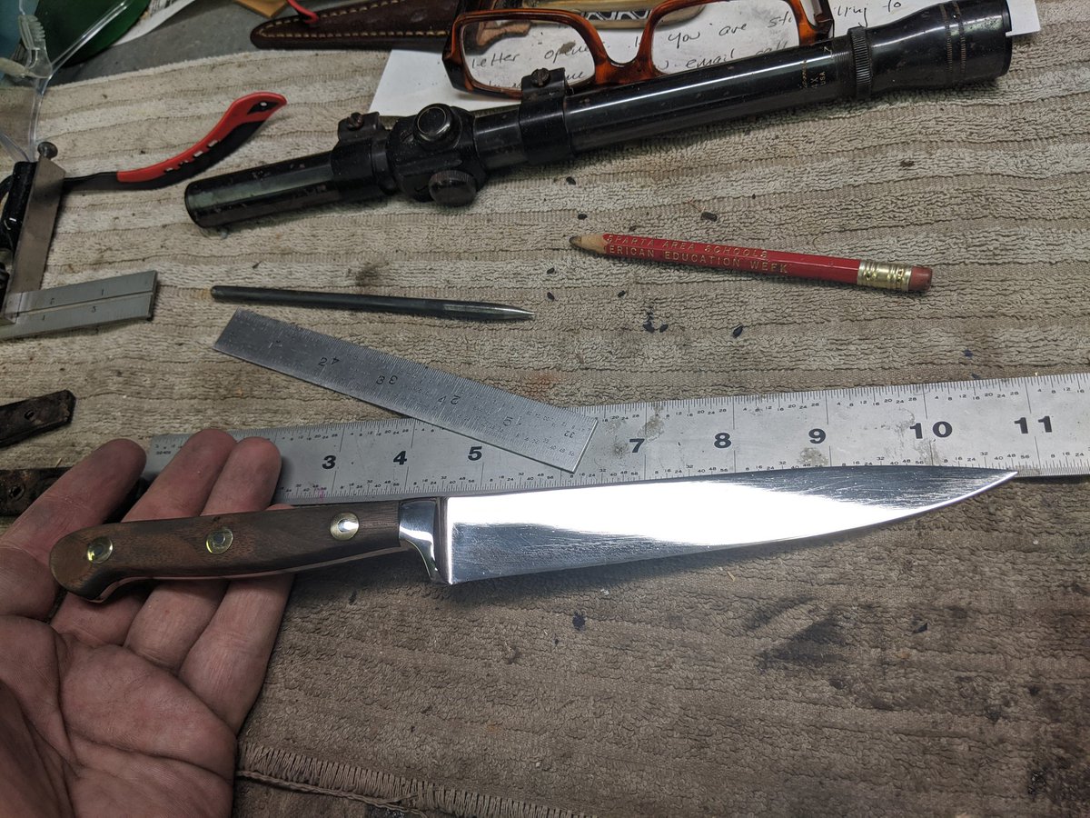 "Oops I accidentally added a 0 to the end of the value of this knife!" is what the buffer had to say:(Note: didn't do a full Hibben level mirror polish; I didn't grind the blade and this is a simple touch up job)