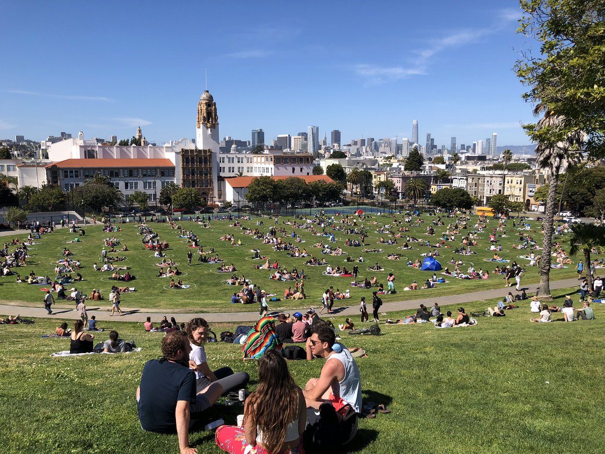 The side with painted social-distancing circles – at  Mission Dolores Park
