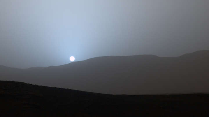 Mie Scattering occurs when large particles, such as the dust on Mars, scatter light. Red having a longer wavelength is then scattered more efficiently, which leads to the red sky during the day, and a blue sunset and sunrise (7/n)