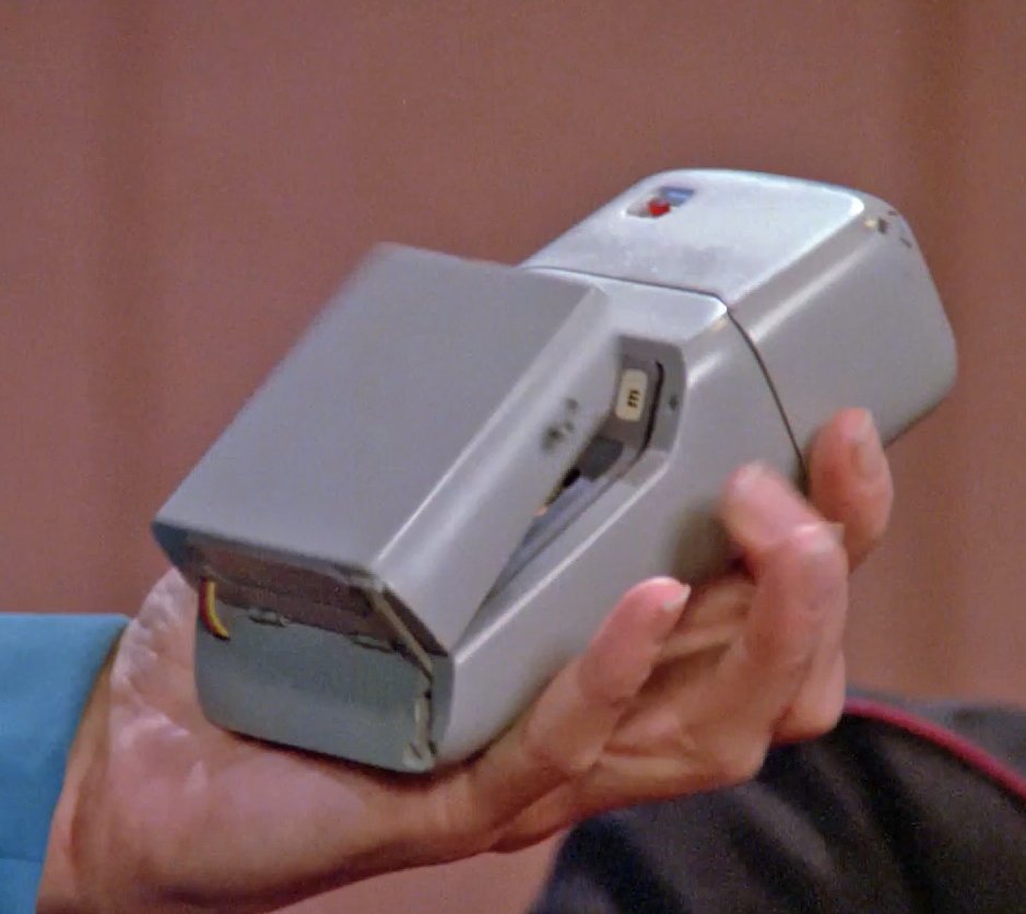 The visible wiring of the Mart VI medical tricorder prop, along with the small band used to open the door when the side latch is released.