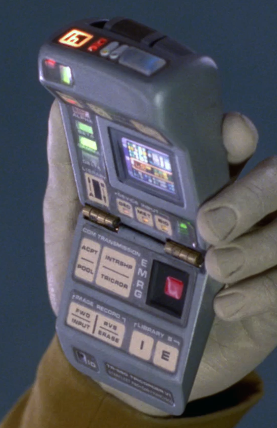 This odd hybrid design also seems to have been used for the Voyager red tricorders, mounted on the walls of sickbay during the first season of the show.