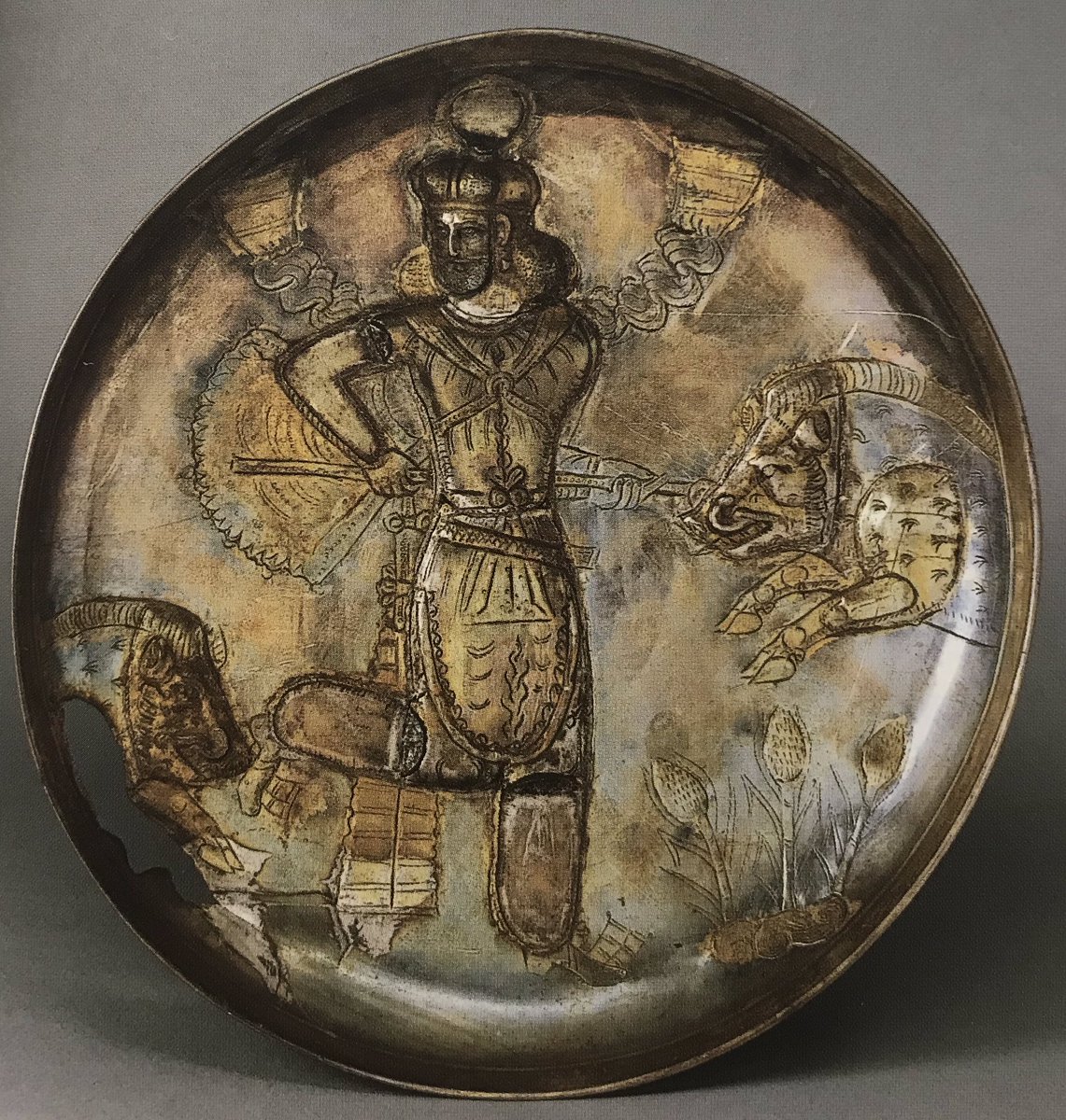 L: Silver plate with a royal figure hunting boars, unearthed in the tomb of a high-ranking general, possibly a gift granted by the Northern Wei emperor. R: Plate from Afghanistan with an almost identical composition, made when Central Asia was under the rule of Sasanian Persia.