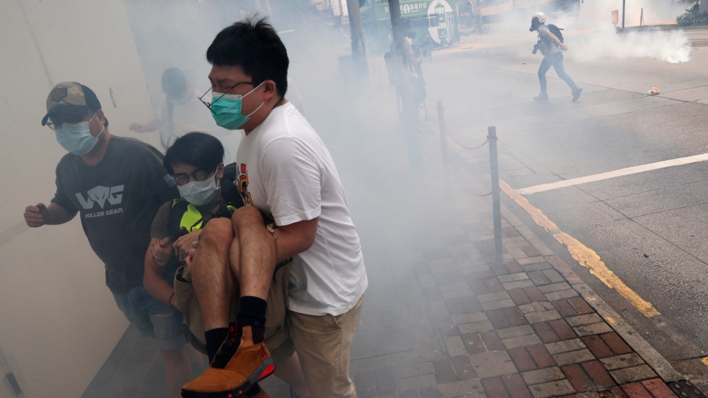 AJEnglish's tweet photo. Police fire tear gas and pepper spray as Hong Kong protest kicks off against proposed security law https://t.co/d3jgysgKNn https://t.co/ppvIQ2lD1H