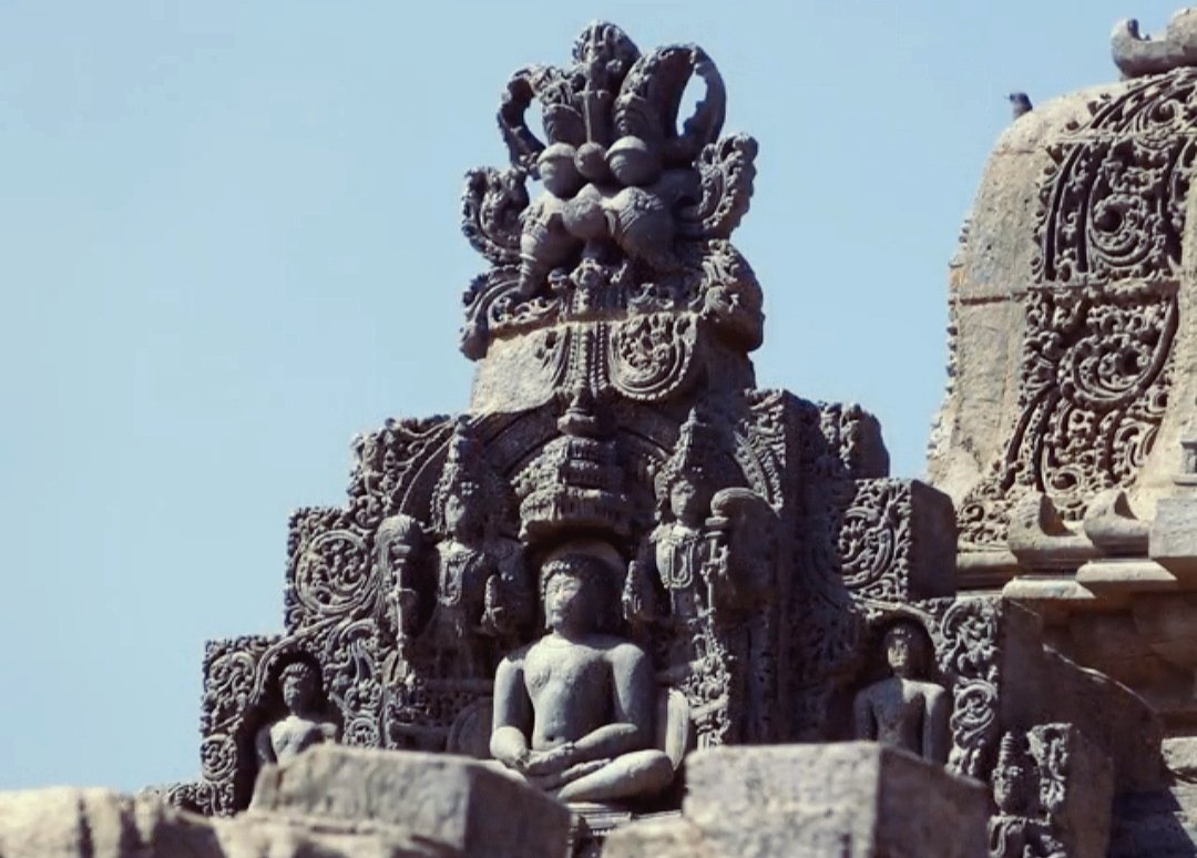 The exterior view of TempleKiritmukha with an beautifully carved tirthankar.