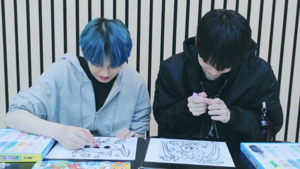 yeonjun and soobin coloring some children's coloring books 