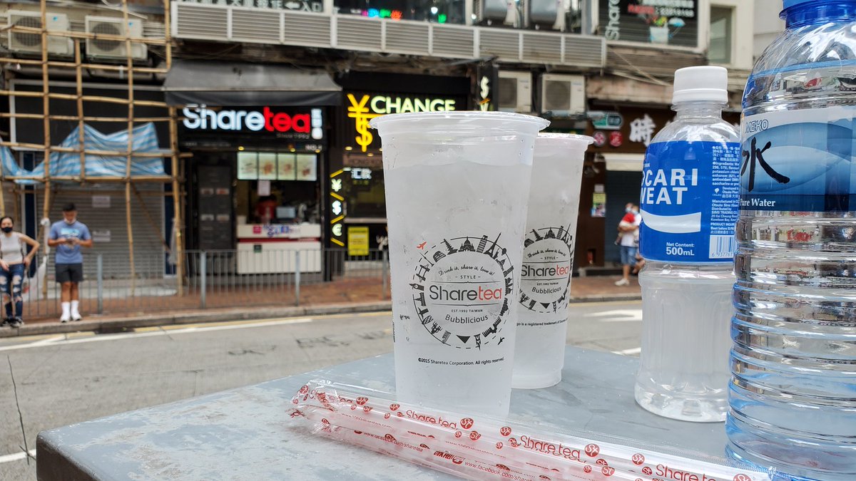 ShareTea, a nearby store, is giving out water to protesters and the press during a lull in the action.