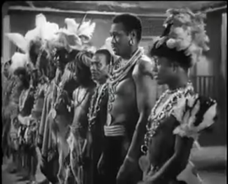 18/The earliest recorded appearance of a Kenyan in a movie must have been Jomo Kenyatta in the 1935 movie Sanders of the River. The future president plays an extra for a total of 6 minutes in the movie3rd from the right below