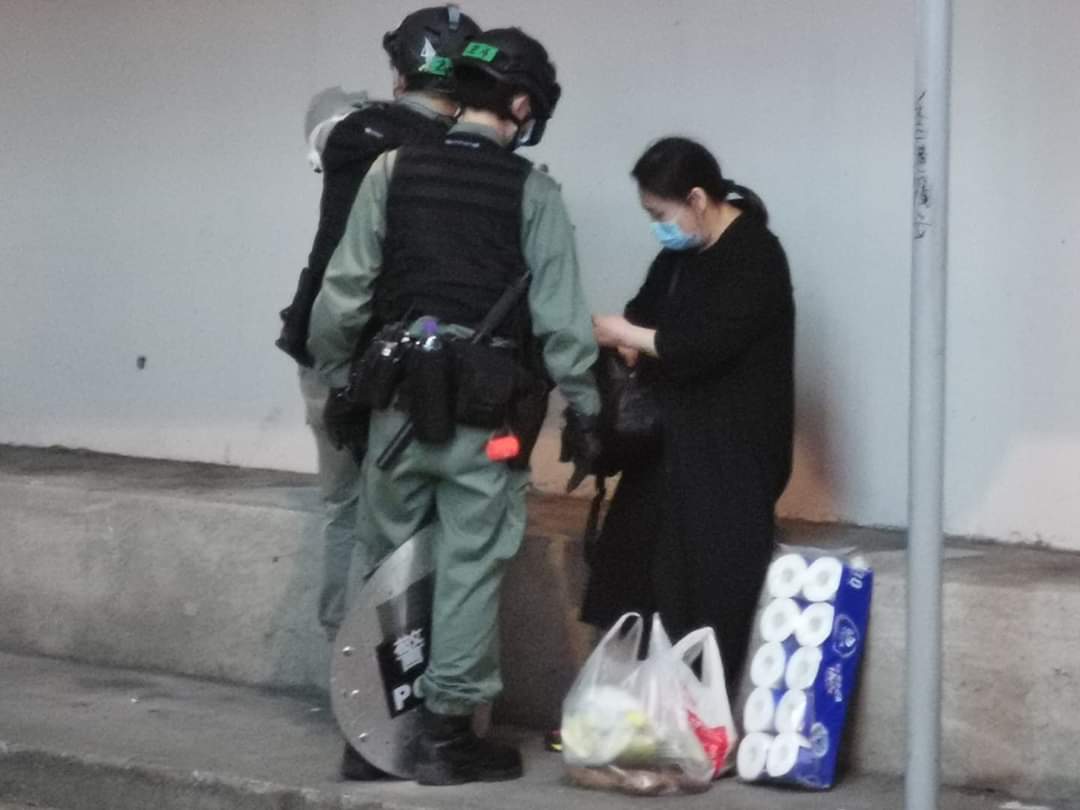 ThePeopleHK's tweet photo. The HK police stop and search a lady with toilet paper and two bags of food in causeway bay early today. 

#HKPolice #standwithhongkong #HongKongProtests https://t.co/5HUsr2M9tv
