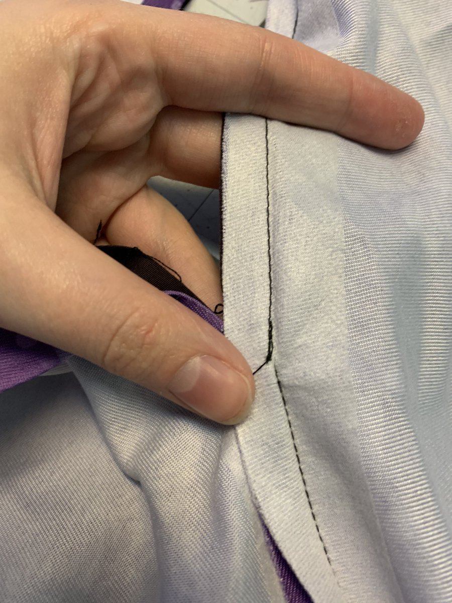 this seam is pretty interesting and i’ll probably copy it. they sewed the self and lining shoulder seams separately, and then sewed up the capelet along the edges, stopping at the edge of the shoulder. basically zero bulk! very cool