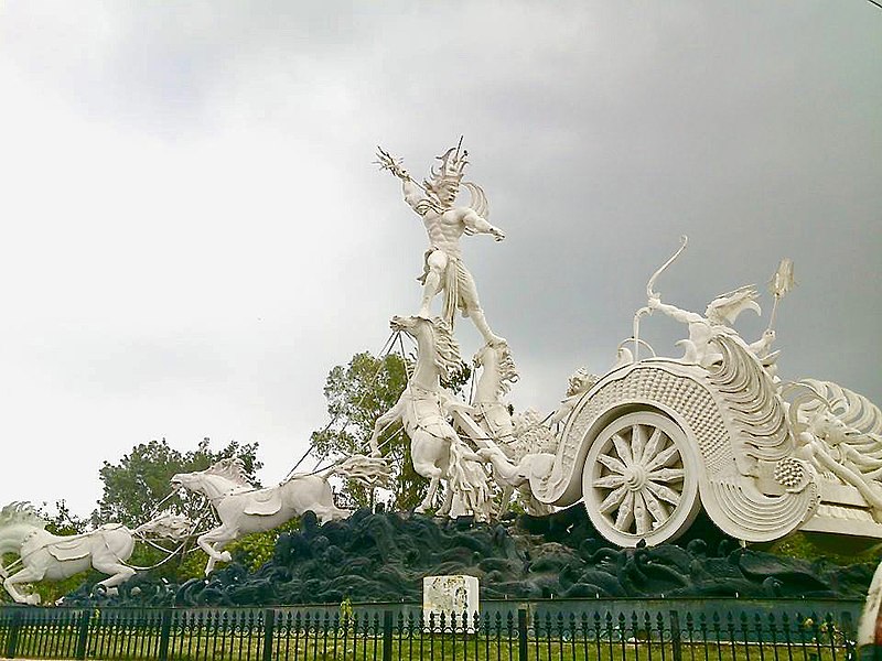 23/23Karna inside the chariot fighting Ghatotkacha standing over horses, Kota, Rajasthan. This artwork – as Patung Satria Gatotkaca – is also found near the Denpasar airport, Bali, Indonesia.End of Karna Parva, 8th Book of Mahabharata
