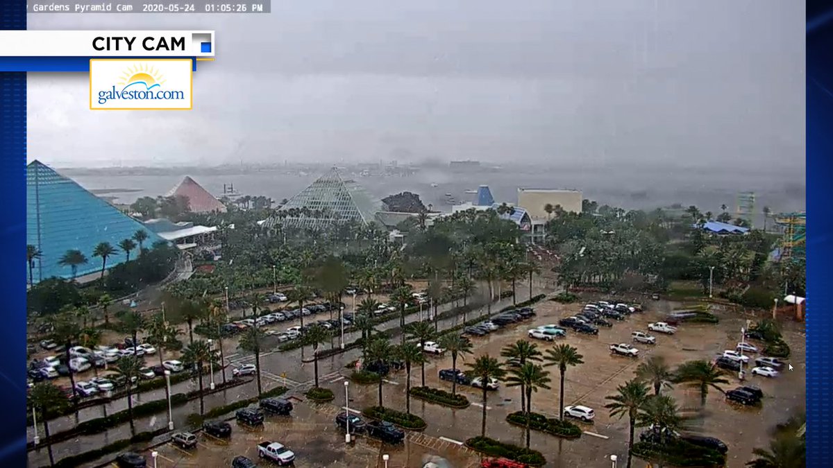 A line of heavy rain showers is passing across Galveston Island