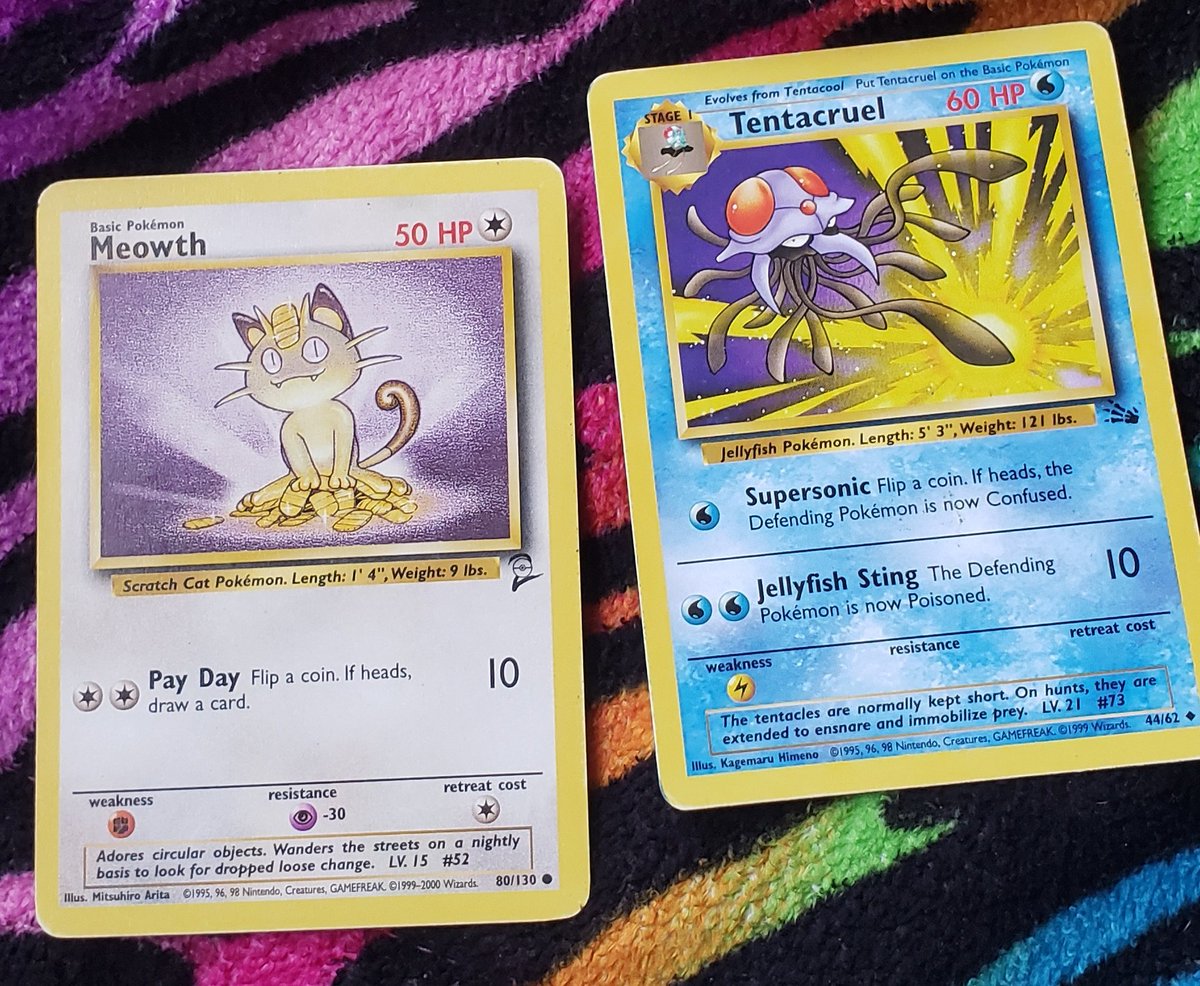 meowth and tentacruel!!the art is very simple but i rlly like it!!