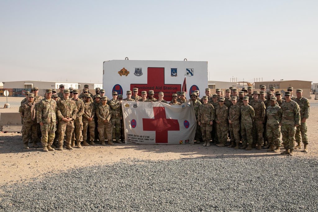 30thabct's tweet photo. U.S. Soldiers from Charlie Medical Company, 230th Brigade Support Battalion #30thabct receive coins and a flag from Col. Jon Dubose, the brigade surgeon, for their hard work while deployed for @TFSpartan in the @CENTCOM area of responsibility, June 5, 2020.(📷by Sgt. Devin Lewis) https://t.co/bCni7qd4r1