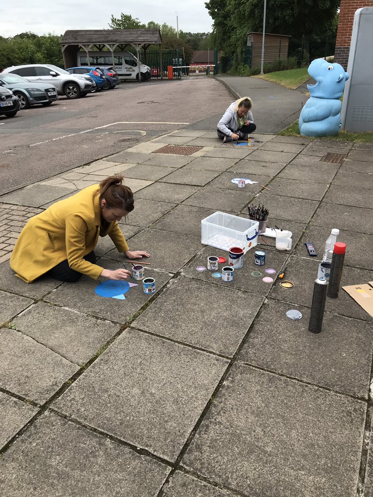 Rowlatts_TMET's tweet photo. Teachers painting social distancing spots for our opening to key year groups on Monday 15th June. #funfaces https://t.co/DQC9bJoXSH