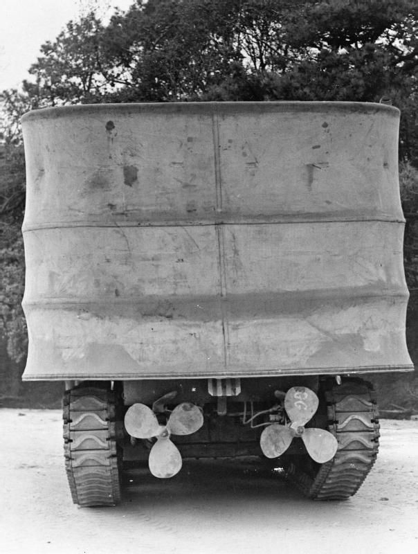 The DD stands for "Duplex Drive" and referred to the alternative propulsion on the back. "Tank" was originally chosen as a codename to make the enemy think they were designed to keep water in. Hobart's gang reversed this and devised ways to keep water out...