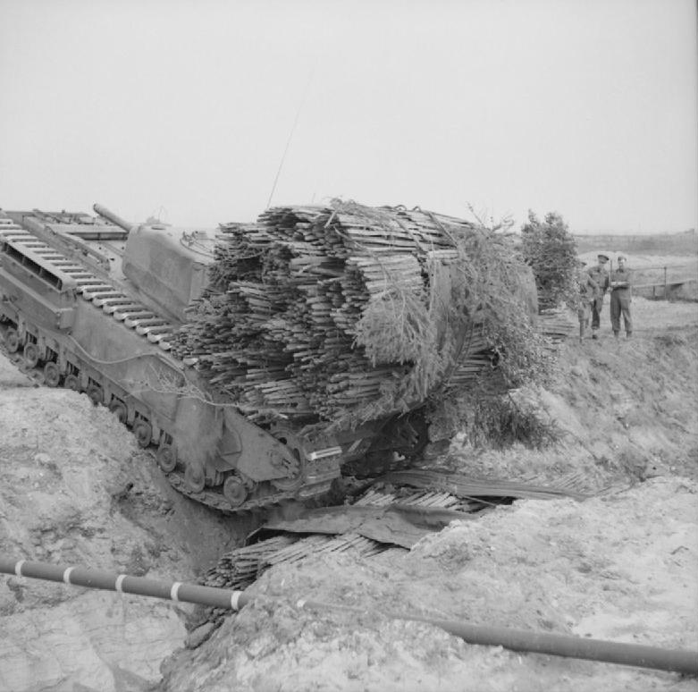 The AVRE could be loaded up with other equipment to solve other problems on the battlefield. The obvious (and long-used) thing to stick on one was the ultra high-tech "bundle of sticks". This could be dropped to fill ditches.