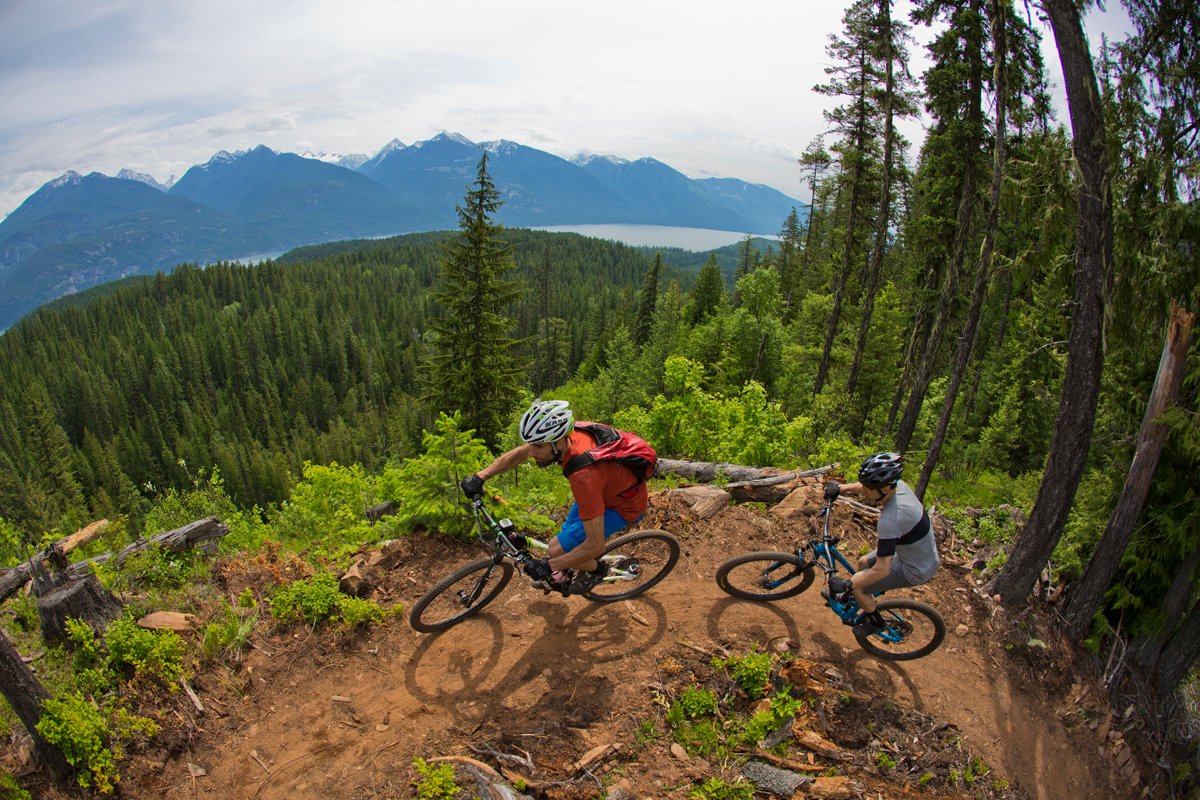 Scouting 🧭 season is here! This beautiful shot is from Kaslo, BC in 2017 in advance of that year’s Singletrack 6. <a href="/travis_hauck/">Travis Hauck</a> and Steve Doucette climb the Strawberry Ridge trail, with expansive views of Kootenay Lake. 
📸 <a href="/gibbymtbphoto/">John Gibson</a>
