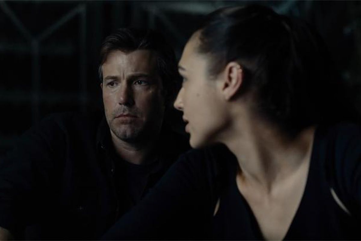 12 - Wonder Woman visits Batman in his Wayne aerospace hangar, and they talk about the invasion.Batman talks about the meta humans they need to find.(There is no scene of the two talking by the lake)