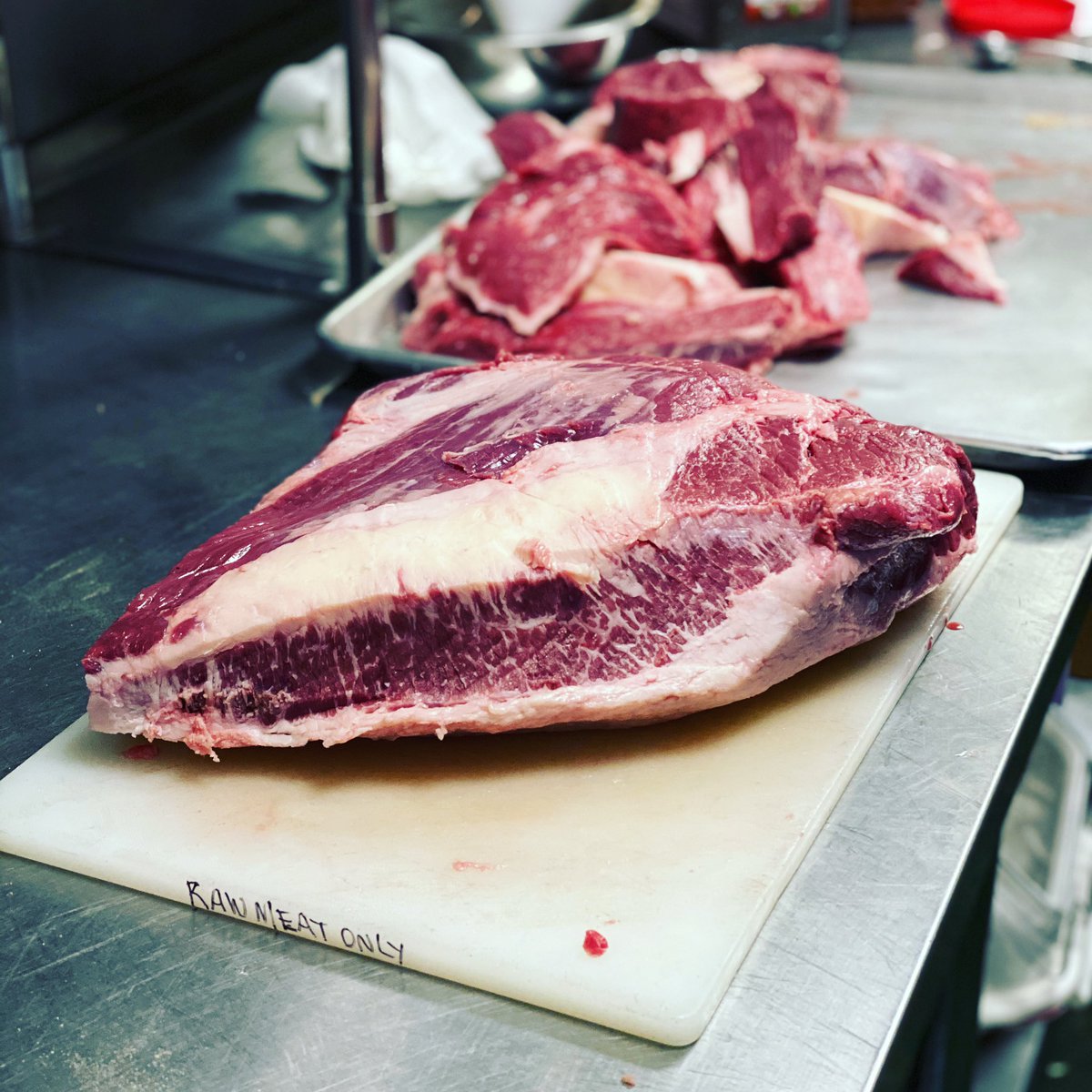 ThompsonBrewing's tweet photo. Corbin is in charge of trimming, seasoning and cooking the brisket - a favorite job of his ❤️ #14goingnon40 #familybusiness #youngestmember #brisket #loadedpotatoes #specialmenu #reopening #teenagersareawesome #thompsonbrewing https://t.co/ibYcdyDUPo