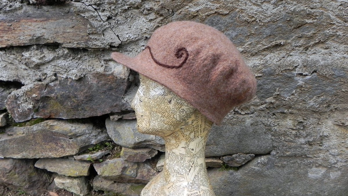 New hats! Handfelted in australian finest merino wool, decorated with leaves and flowers. The edelweiss in a pin and can be used separetely. 
These two are very light berets can be used in spring/autumn or even a cold summer day.

pecorelle.etsy.com
