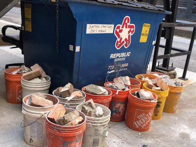Chicago_Police's tweet photo. Officers from @ChicagoCAPS01 recovered 14 buckets of suspected projectile weapons this morning in the South Loop. CPD is working hard to keep the public safe and violence against those expressing their First Amendment rights and/or our officers will not be tolerated. https://t.co/LtKQtXvoLd