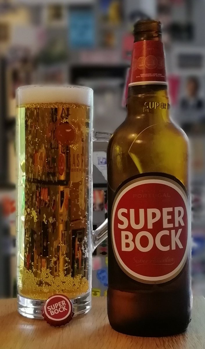 I started with Super Bock for no other reason than it was the first on the shelf. It pours a handsome burnished gold with a fine head. Maltier than expected and not as sweet as I feared. Refreshing. Large bottle makes for good value. Can imagine it goes down well on the Algarve!