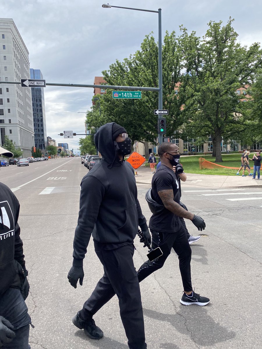 JamesPalmerTV's tweet image. Von Miller and Kareem Jackson marching in downtown Denver.