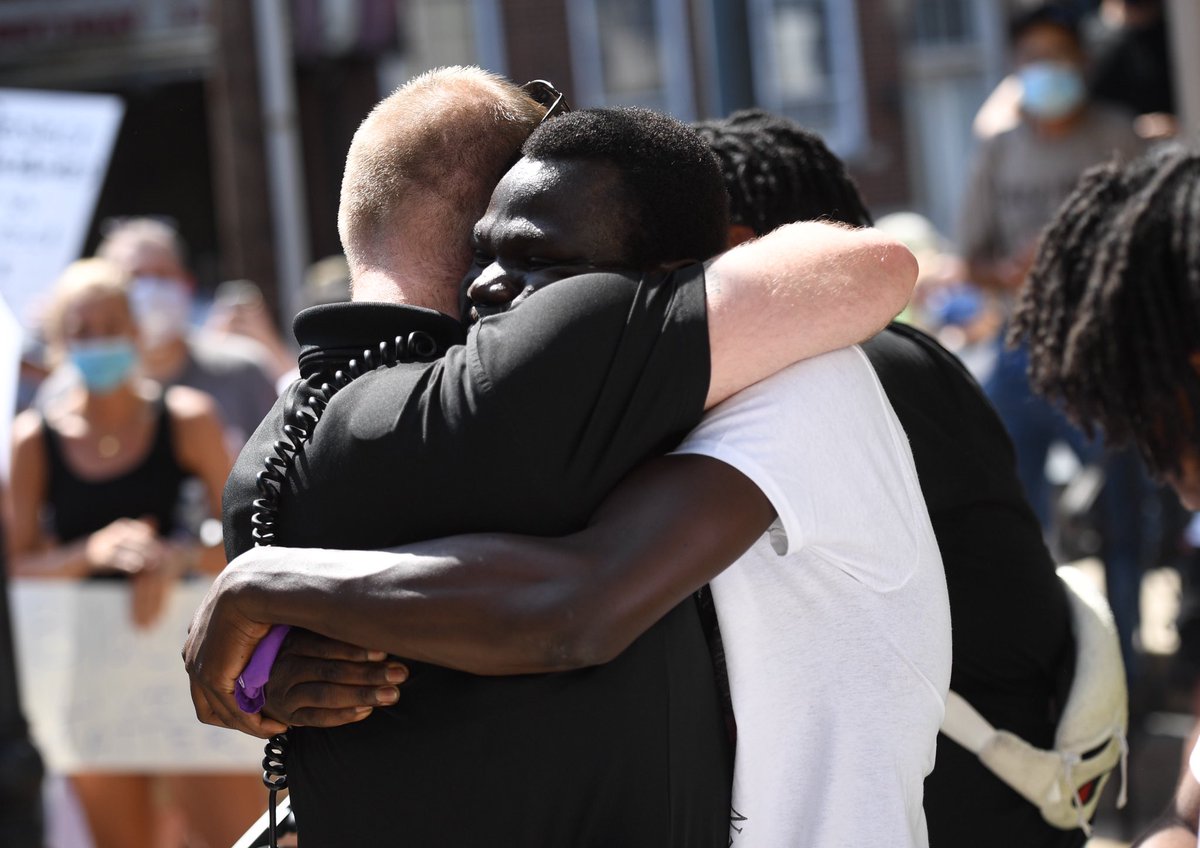 tylohrphoto's tweet image. Alaak Deu, 21, pointed at an Elizabethtown police officer and asked, “is being black a crime?” 

The officer replied: “absolutely not” and hugged him.