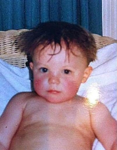 Louis tomlinson as a baby but as you slide down he grows up and you feel proud; a thread.