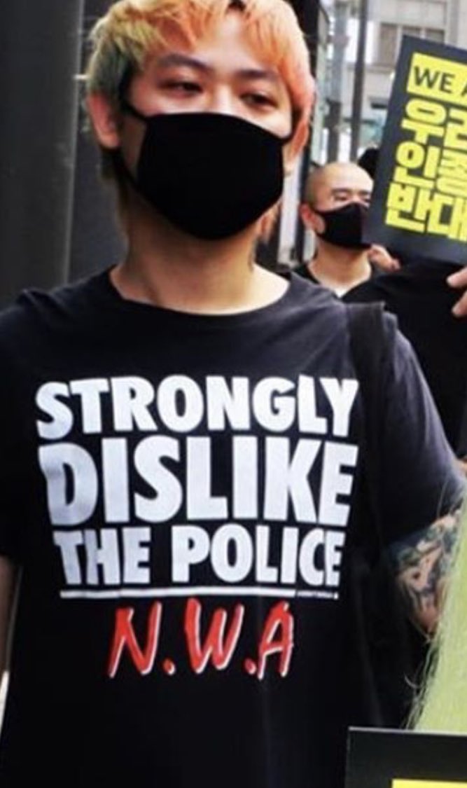 Someone posted this pic from a protest in Korea and i noticed this guys bootleg N.W.A. shirt in the back “STRONGLY DISLIKE THE POLICE” 😂😂😂