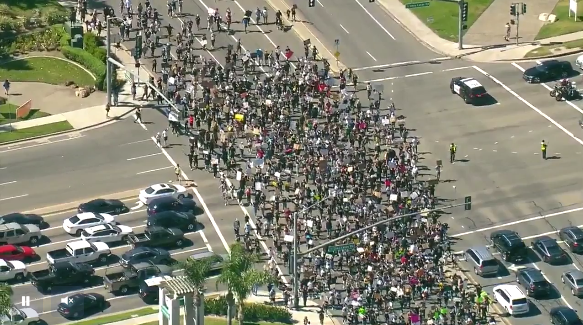 10News's tweet photo. Hundreds of people march through the Eastlake area of Chula Vista demonstrating against police brutality | Watch Sky10 live: https://t.co/4BOmH5zzGE https://t.co/ZWgzUD0A1P